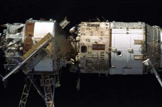 Survey views of the Mir space station taken by the crew of the STS-86 orbiter Atlantis including Kvant-1 (left) and Base Block (right).